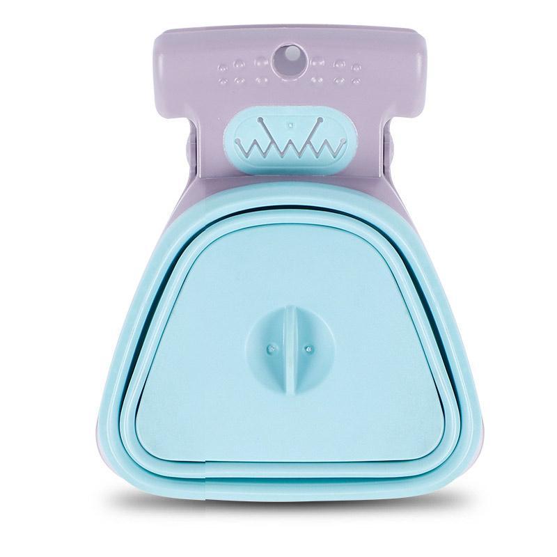 Compact dog waste scooper, ideal for outdoor walks and travel, ensuring clean pet waste removal