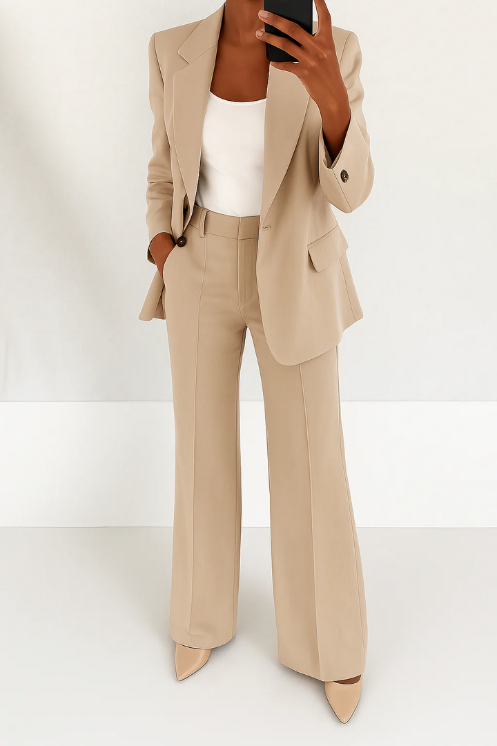 Stylish women's two-piece formal suit featuring a modern blazer and elegant trousers for business.