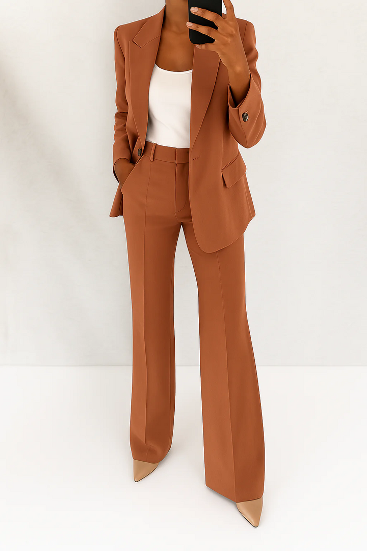 Power suit for women: a two-piece professional blazer & trouser set, perfect for executive office attire.