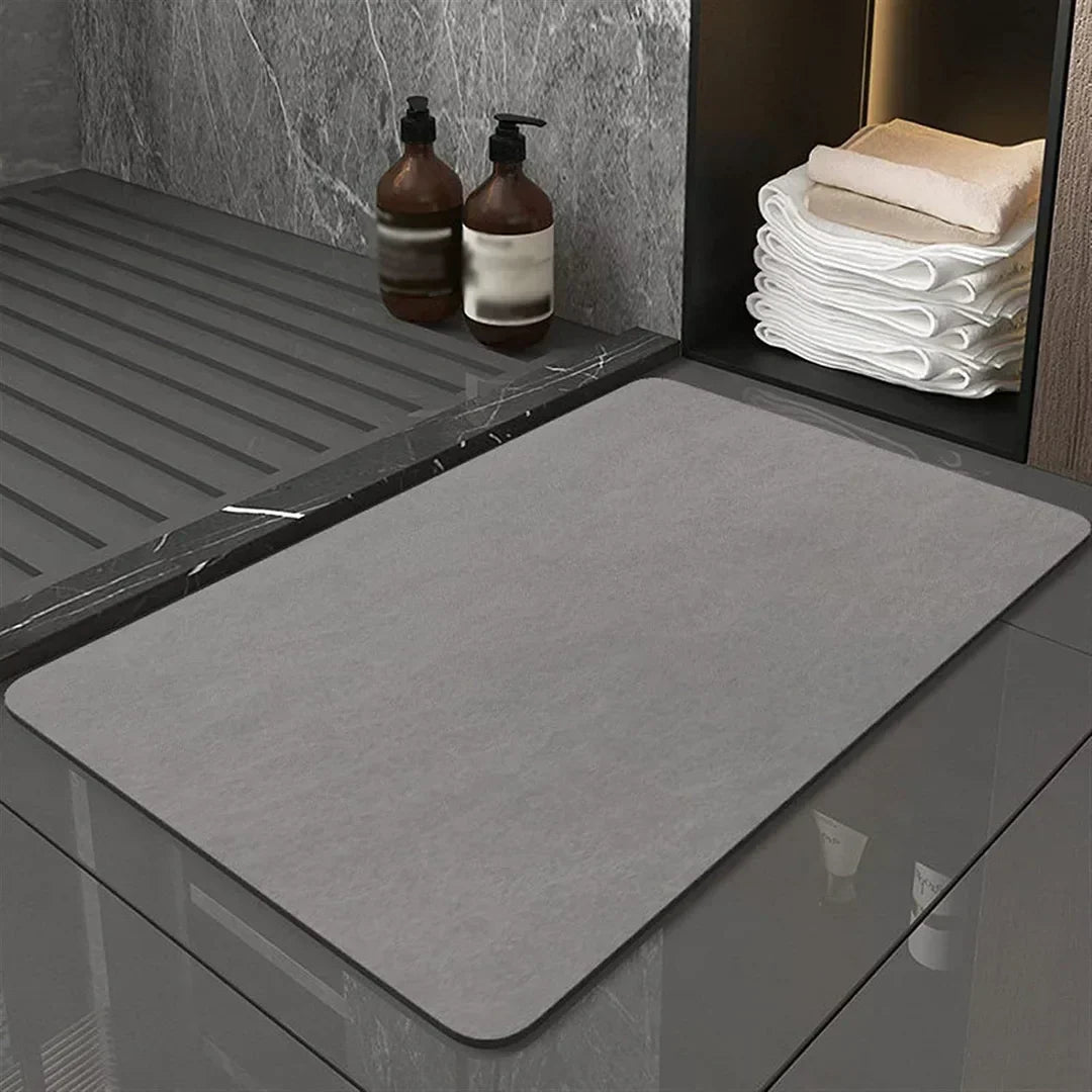 Anti-slip quick dry diatomite bath mat for bathroom safety, highly absorbent and secure on floors.