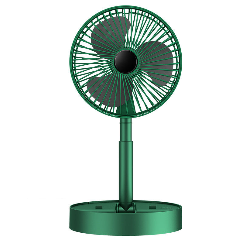 Personal cooling device: a white rechargeable fan on a cluttered desk.