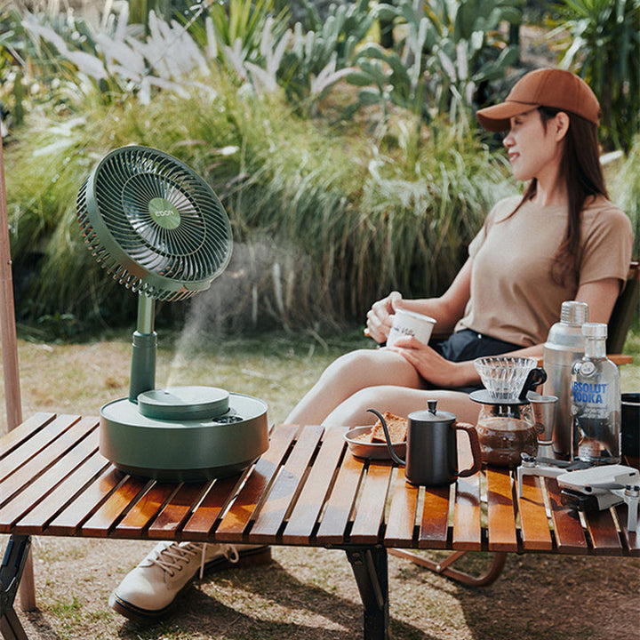 Rechargeable folding table fan, viewed from above, highlighting its circular grilles.