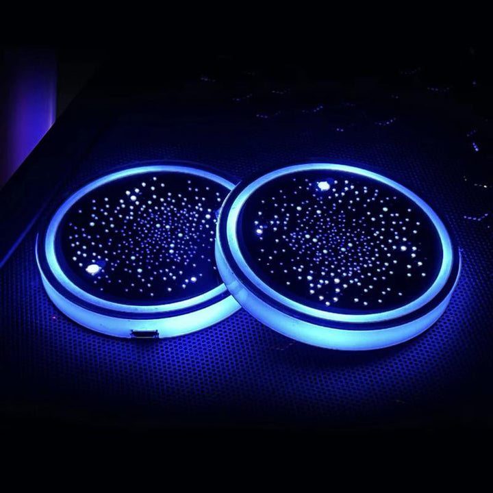 Car interior at night with glowing LED Cup Holder Coasters, stylish auto accessory