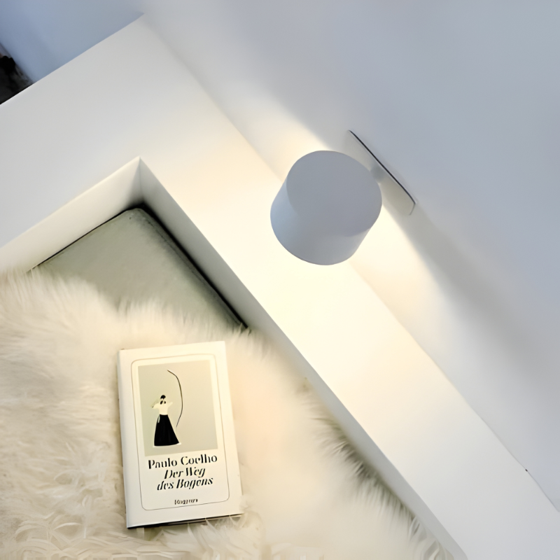 Cordless reading light, rechargeable, magnetically attaches to wall mount.