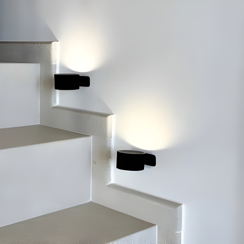 Adjustable LED wall light, portable design with 360° magnetic rotation.