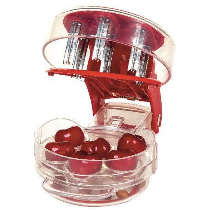 Variety of cherries being prepared with a 6-cherry capacity pitter, kitchen efficiency.