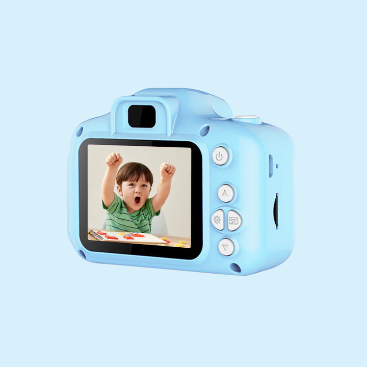Side profile of a green reusable toy camera, emphasizing its ergonomic and child-friendly grip.