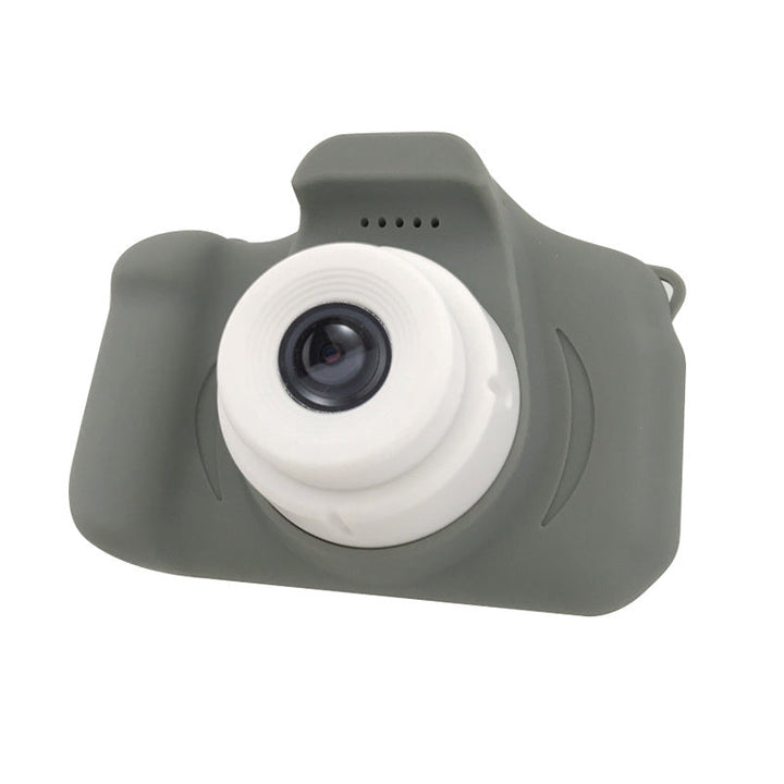 Children sharing a yellow reusable mini digital camera, highlighting its social and interactive aspect.
