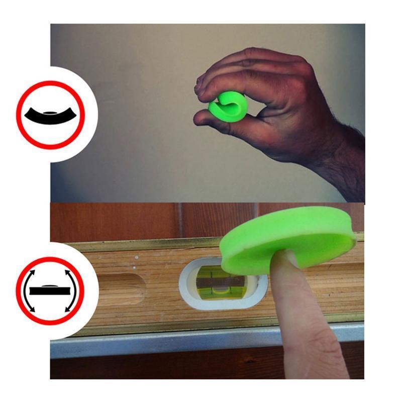 Yellow silicone flying disc toy, shown in hand to emphasize its pocket-friendly size for easy transport.