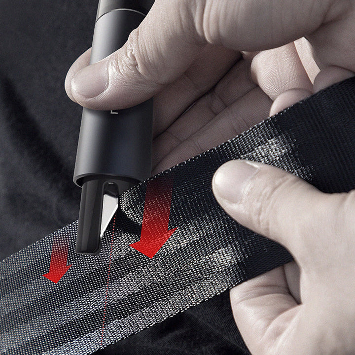 Detailed view of the emergency tool's window breaker tip, ready for use in car safety scenarios