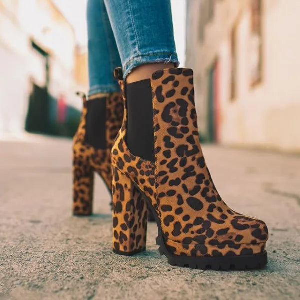 Three pairs of women's block heel boots: red, black, and leopard, showcasing comfort & style