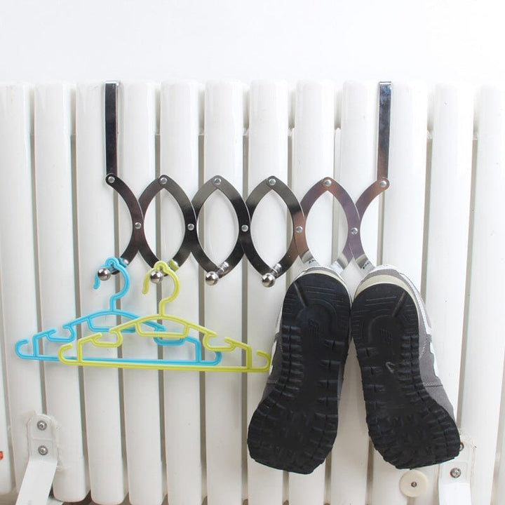 Empty retractable over-the-door metal hook rack, ready for use as a versatile storage solution