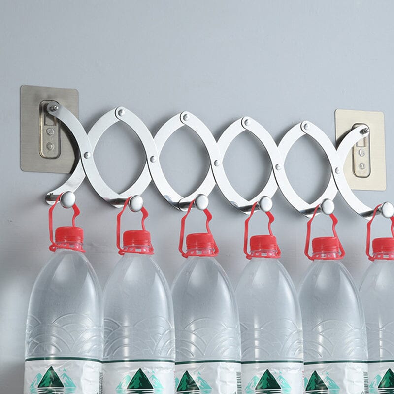 Chrome finish retractable hook rack fitting neatly over a door, perfect for home organization needs