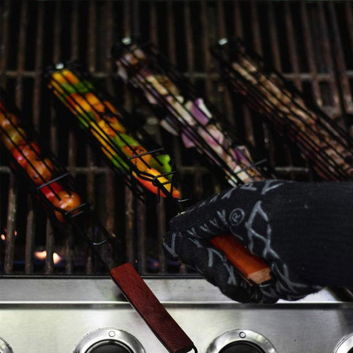 Assortment of grilled kabobs in nonstick baskets, showcasing perfectly cooked vegetables and meats on the BBQ.