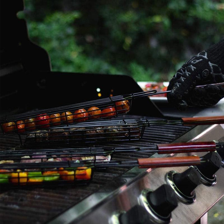 Package of two reusable grill kabob baskets, an essential outdoor cooking accessory for barbecue enthusiasts.