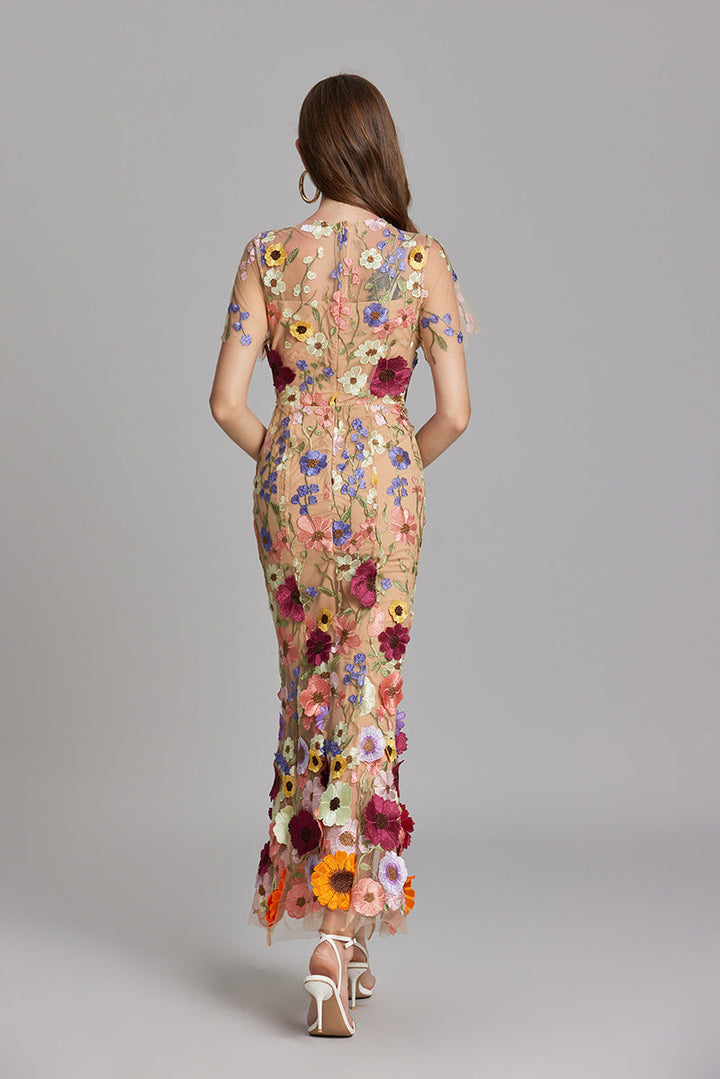 Elegant women's mermaid prom dress, intricate floral appliqué, long.
