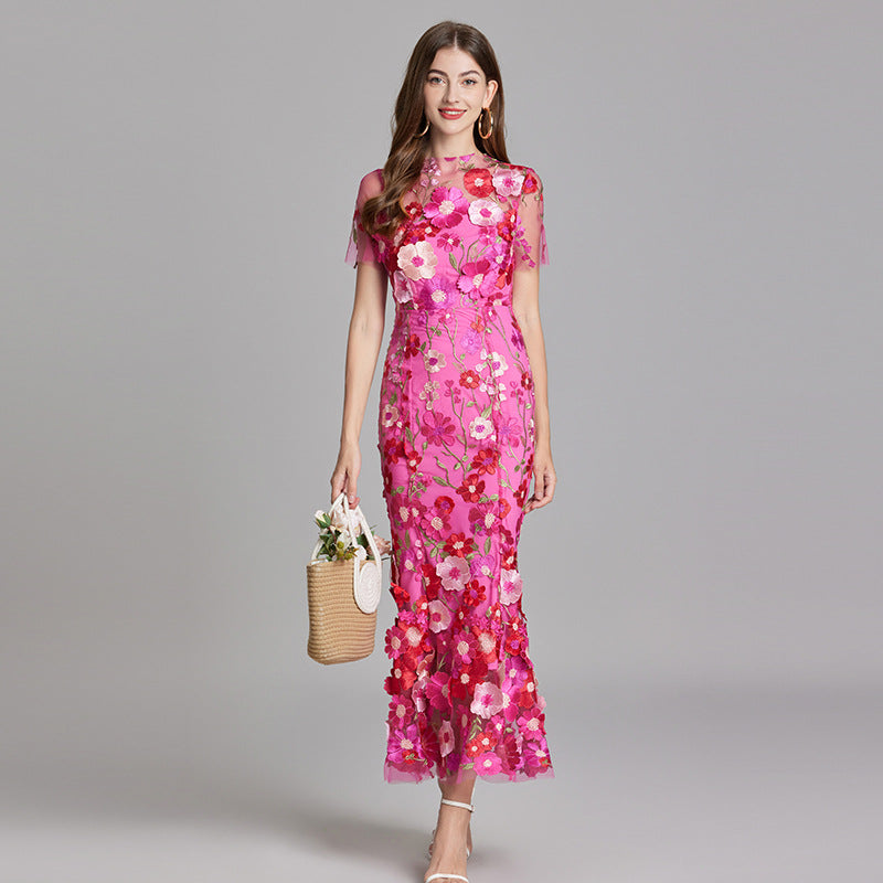 Formal long evening dress featuring romantic floral appliqué.