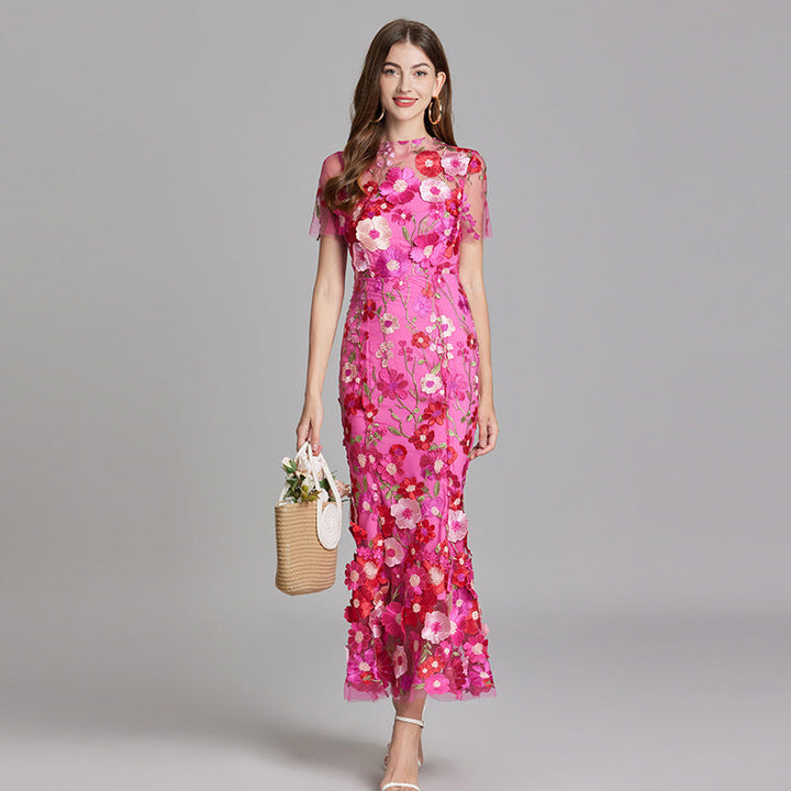 Formal long evening dress featuring romantic floral appliqué.
