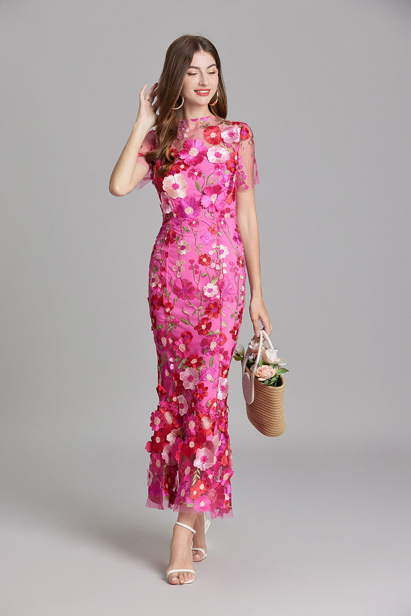 Women's special occasion mermaid gown, illusion neckline, floral details.