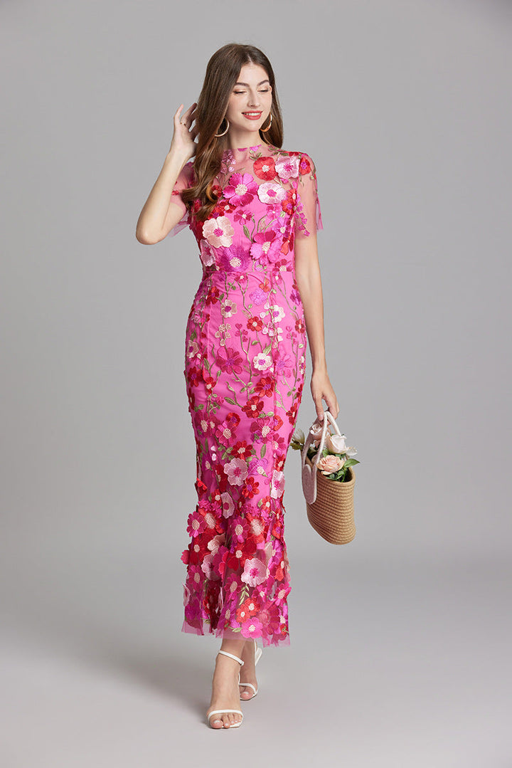 Women's special occasion mermaid gown, illusion neckline, floral details.