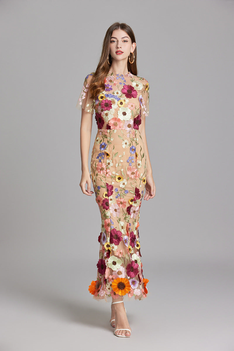 Long romantic women's gown, mermaid silhouette, delicate floral appliqué.