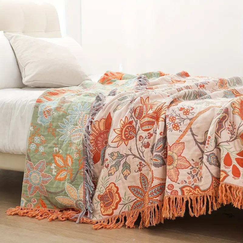 Bohemian cotton throw with a rustic floral pattern, perfect home accent.