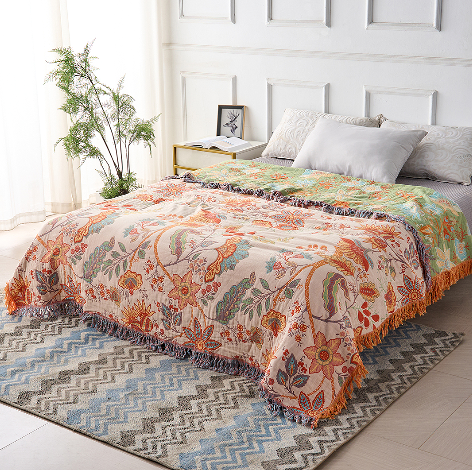 Soft, machine washable rustic floral cotton blanket, ideal for cozy decor.