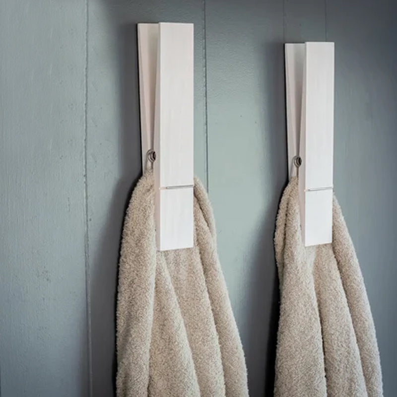 Rustic bathroom accessory: wall mounted towel holder with an authentic clothespin design.