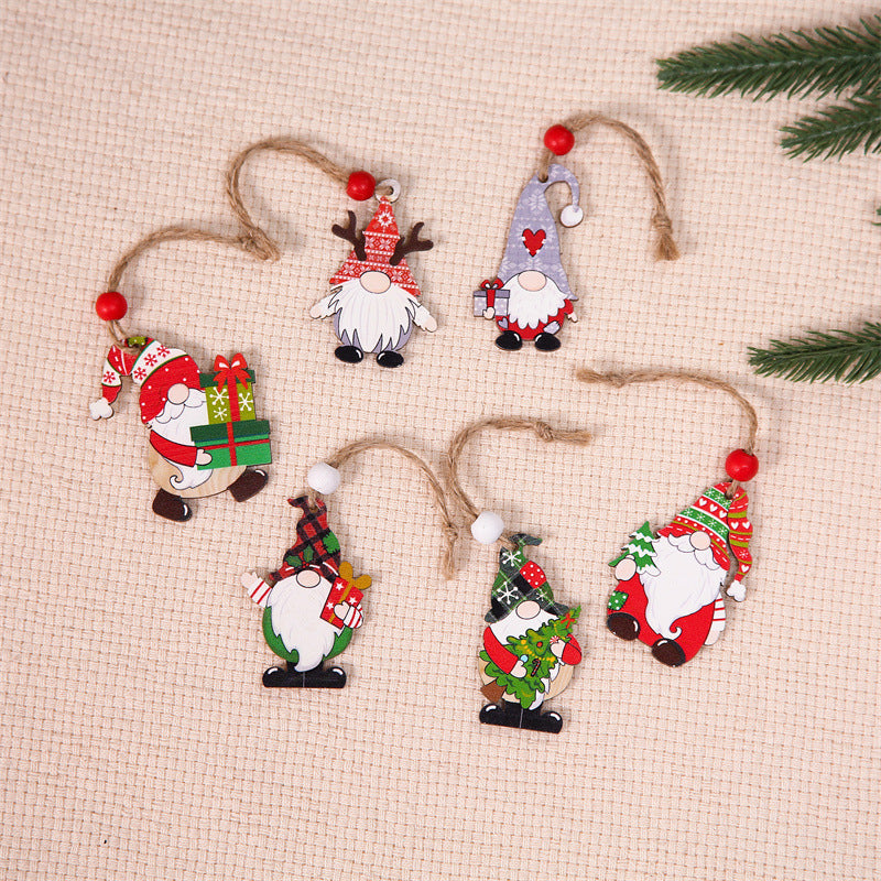 Front view of three wooden gnome ornaments, ready to hang for festive Christmas decoration
