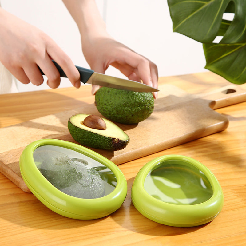 A hand placing food into a Reusable Food Film Storage Box, emphasizing ease of use for food storage