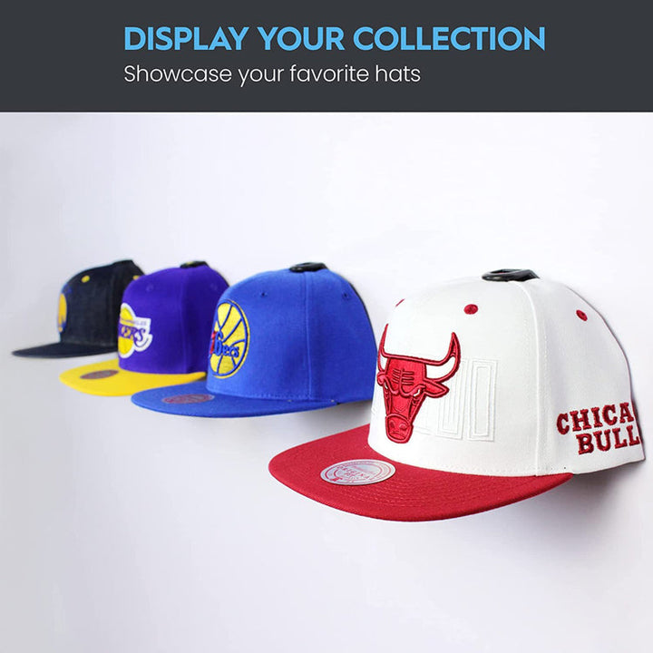 Adhesive wall hooks effortlessly organizing baseball caps, showcasing a clean home storage solution.