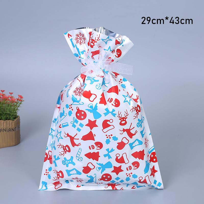 Variety of reusable Christmas drawstring gift bags with classic holiday motifs like Santa and snowmen, durable