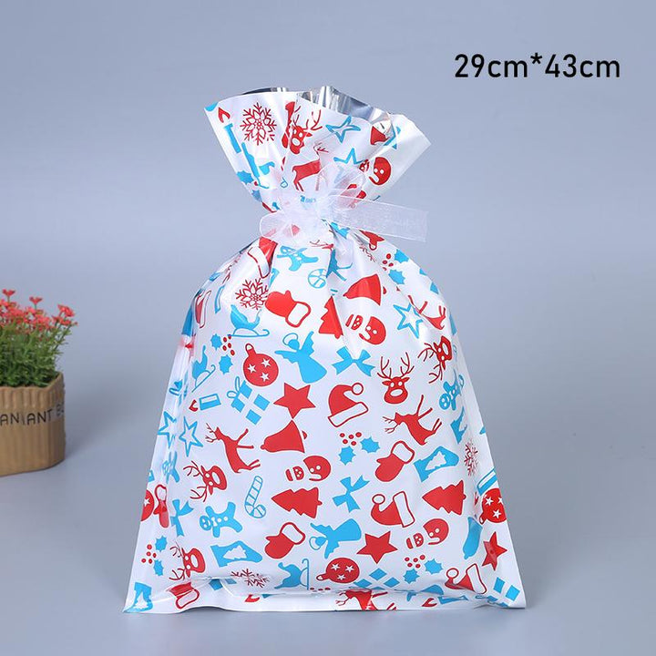 Variety of reusable Christmas drawstring gift bags with classic holiday motifs like Santa and snowmen, durable