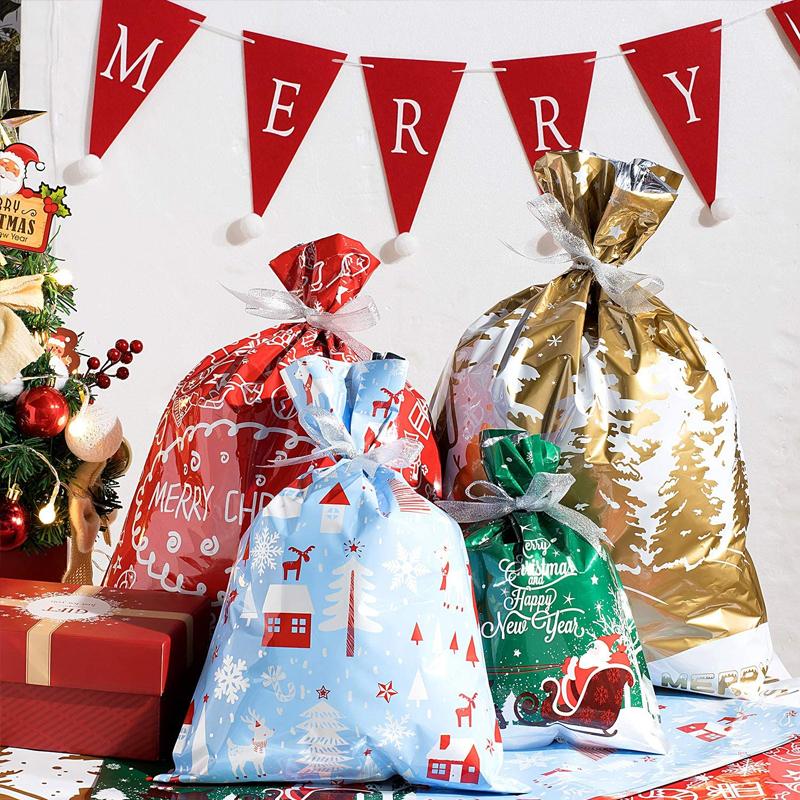 Assortment of colorful reusable Christmas drawstring gift bags featuring various holiday patterns like stars and trees
