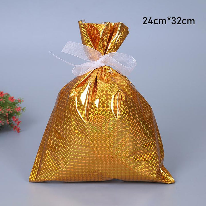 Collection of durable reusable Christmas gift bags, showcasing their drawstring closure and festive holiday designs