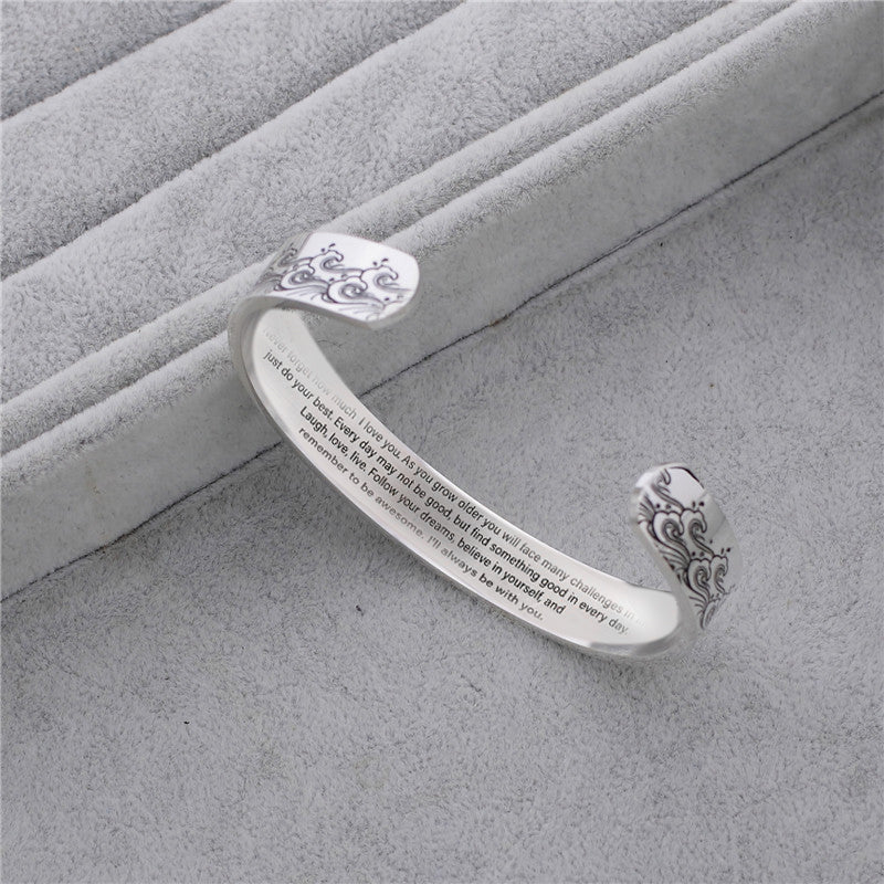 Detailed view of the typography and design of the love message on the granddaughter bracelet