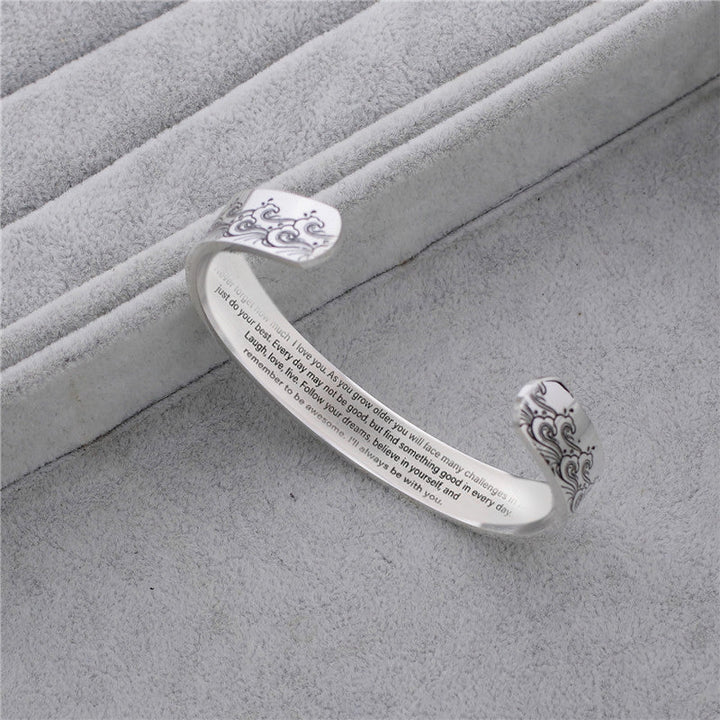 Detailed view of the typography and design of the love message on the granddaughter bracelet