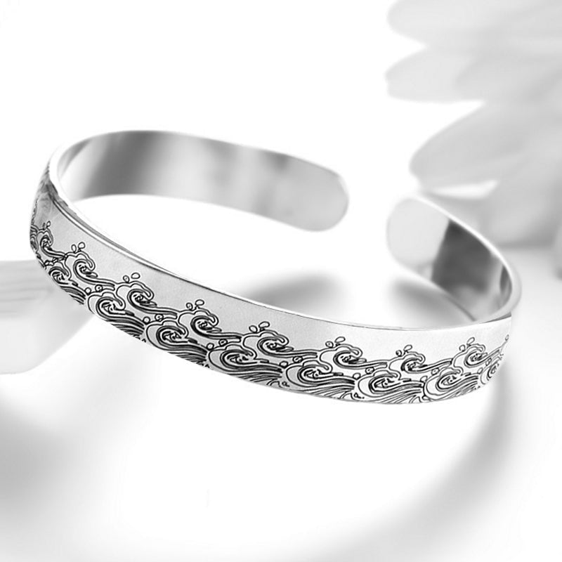 Stack of two granddaughter cuff bracelets, highlighting the engraved details and material