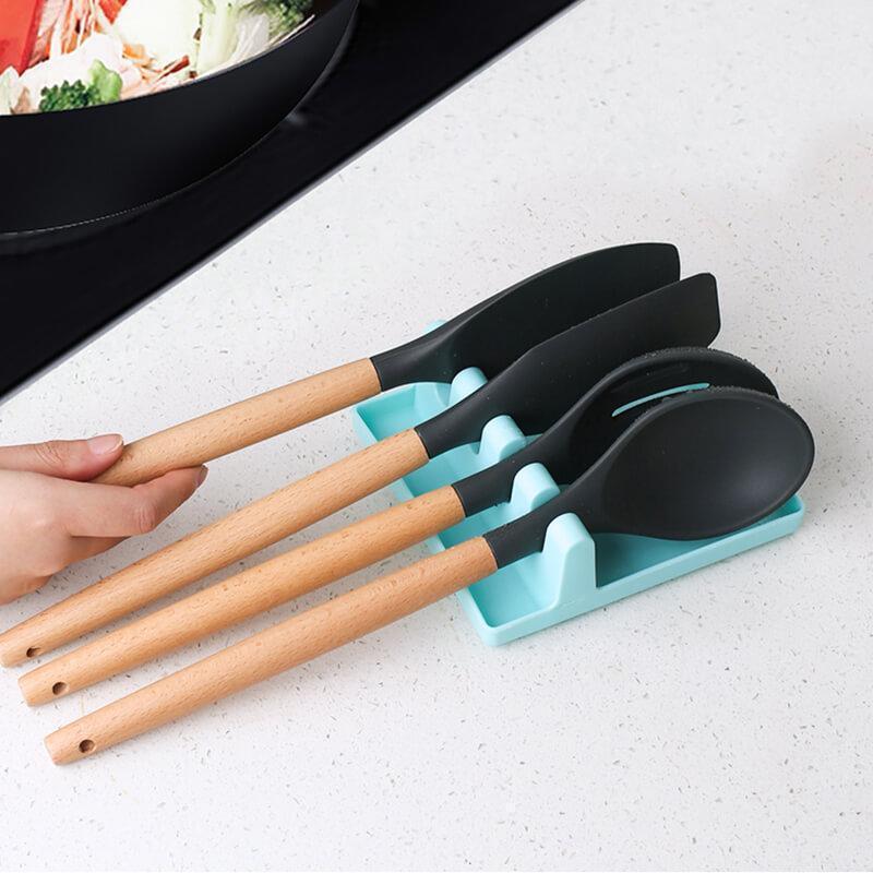 Flexible silicone kitchen utensil rest, designed for spatulas and cooking tools, countertop organizer