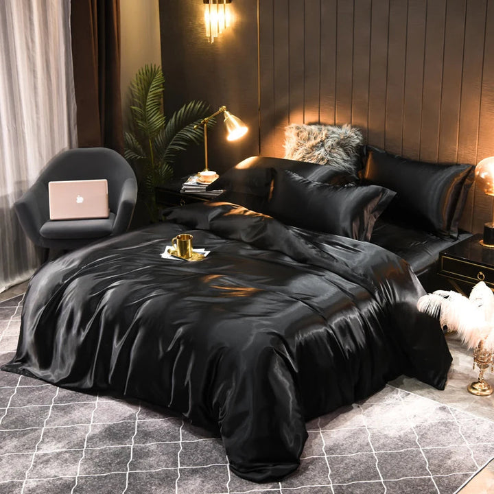 Soft satin fitted sheet and pillowcases for a smooth sleep experience and modern bedroom.