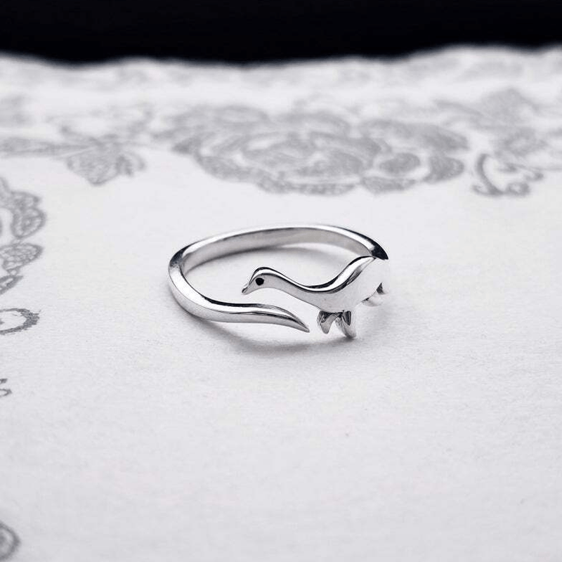 Unisex cute dinosaur ring in adjustable silver metal, perfect statement piece for animal jewelry fans