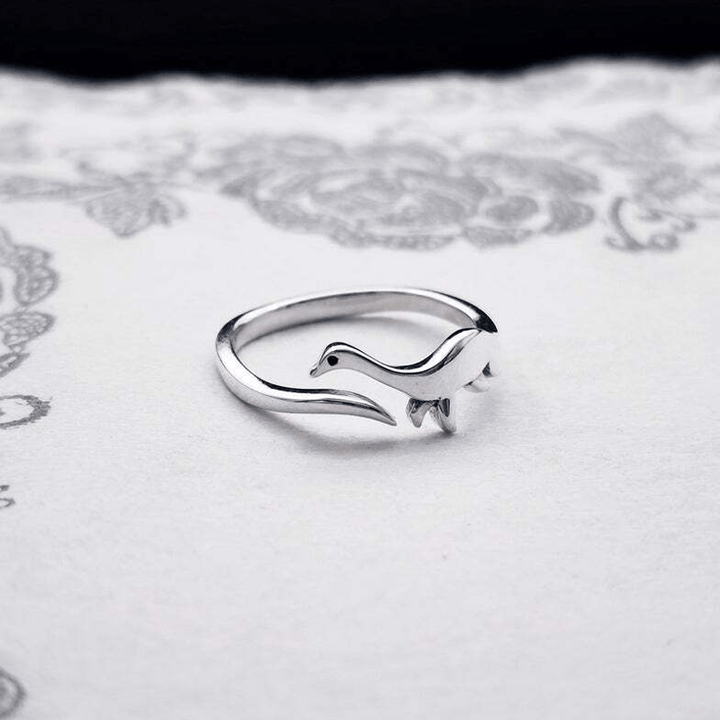 Unisex cute dinosaur ring in adjustable silver metal, perfect statement piece for animal jewelry fans