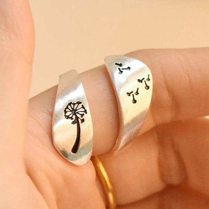Elegant adjustable silver ring featuring a dandelion and mountain motif, fashion accessory