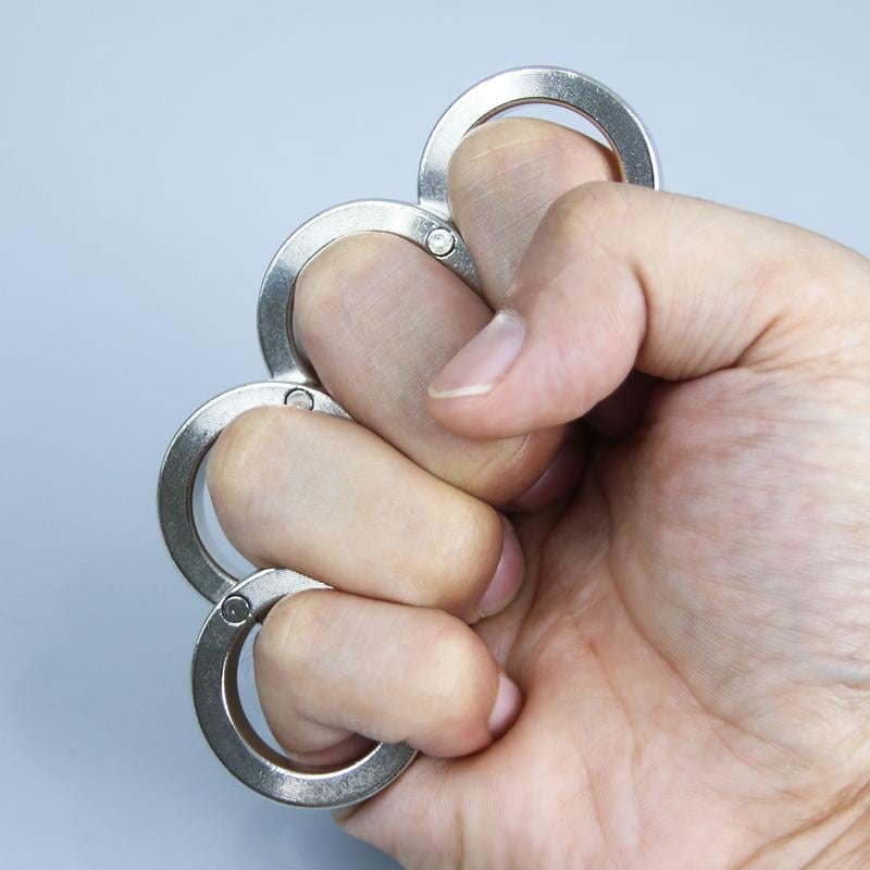 Silver folding four-finger stress relief ring, a portable fidget tool for anxiety reduction & focus.