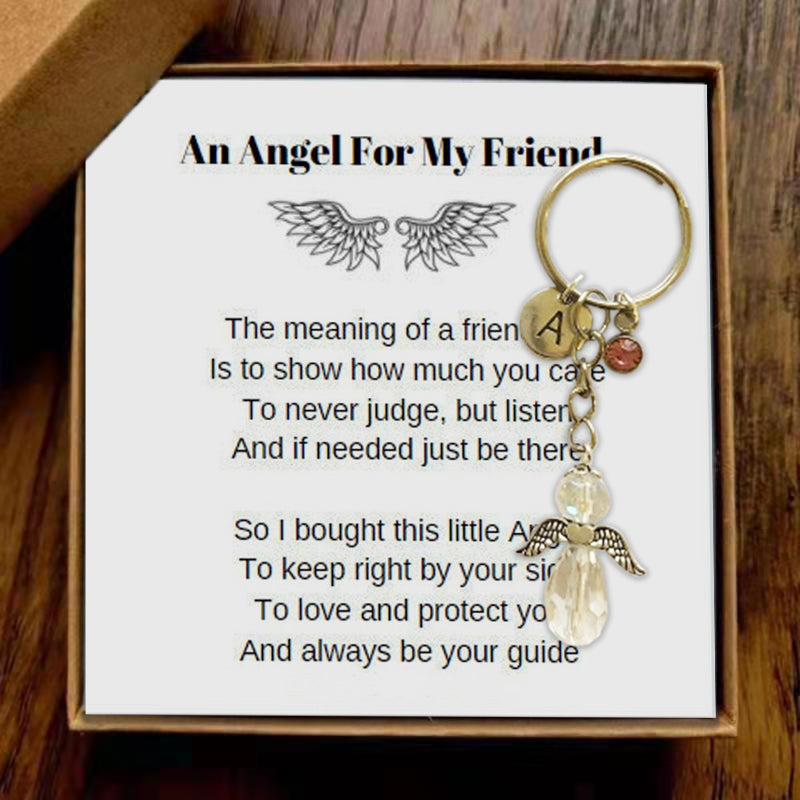 Close-up of alloy angel keychain with intricate wing details, ideal accessory & charm for bags.
