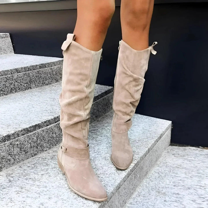 Structured women's boots, transitioning effortlessly from casual wear to dressy occasions.