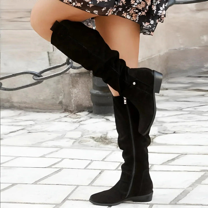 Modern women's boots, combining a sleek look with structured comfort for versatile dressy/casual outfits.