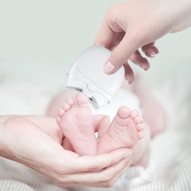 Automatic nail clipper, electric and rechargeable, showing its compact size and night light feature.