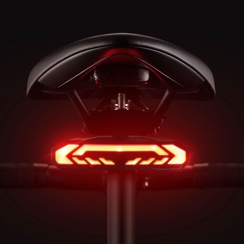 Smart bicycle rear light with alarm, USB rechargeable, waterproof for cycling safety & theft protection.