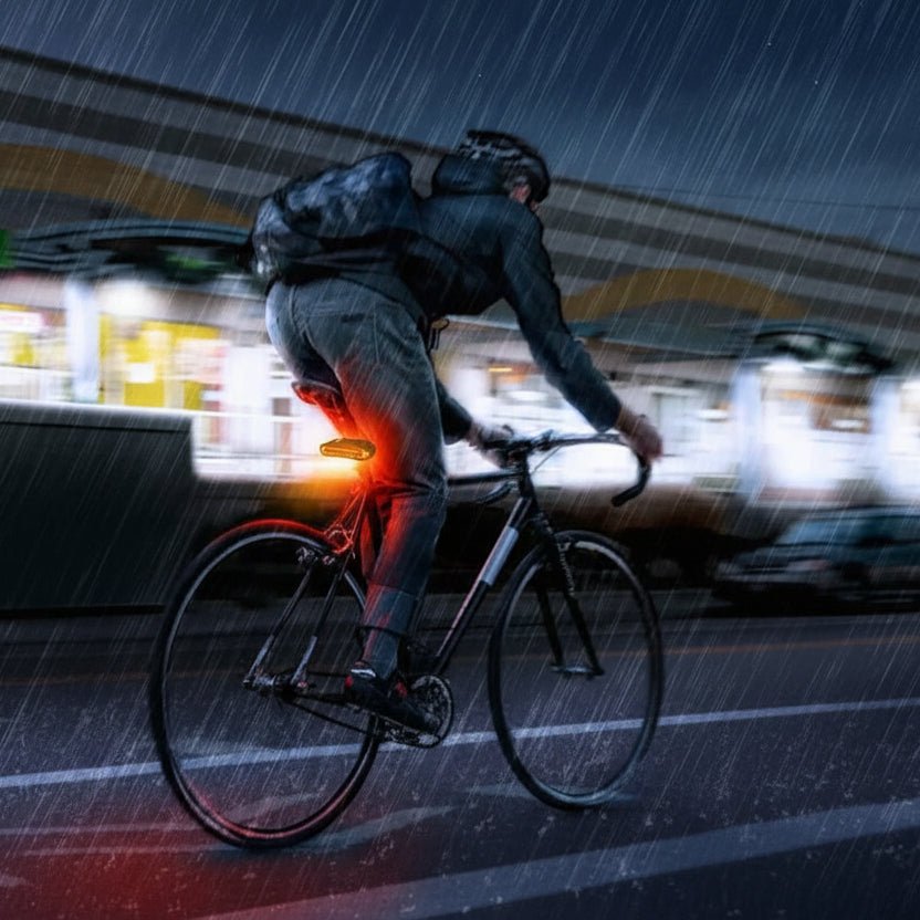 Bright smart bike rear light enhances cycling safety. Features alarm, theft protection & waterproof design.
